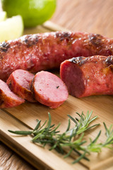 grilled meat sausages with potatoes and tomatoes