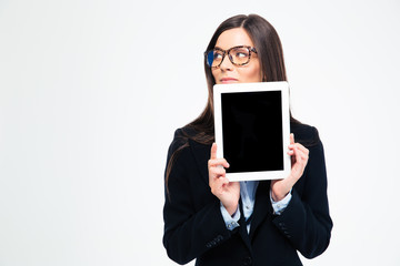 Thoughtful businesswoman showing tablet compute