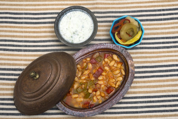 Turkish traditional meal, beans, rice, mixed pickles and tzatziki