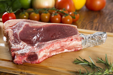 Prime ribs raw on the board
