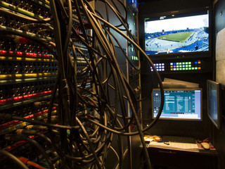 Wide shot of vision mixing panel in a television gallery. 