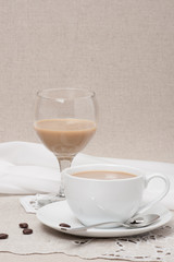 Cup Of Coffee and Irish Cream Liquor. Natural Linen Background