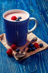 Raspberry and blueberries yogurt