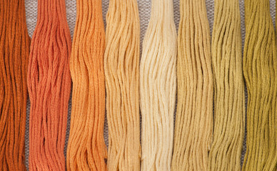 Colorful Threads Set. Natural Linen Background