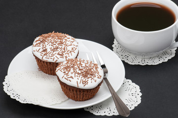 Cupcakes With Cocoa White Cream And Sprinkles. Cup Of Coffee