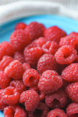 Raspberry on old vintage wooden table.