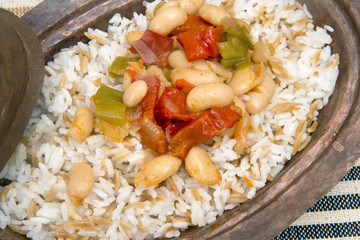 Turkish traditional meal, beans, rice, mixed pickles and tzatziki