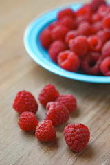 Raspberry on old vintage wooden table.