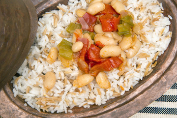 Turkish traditional meal, beans, rice, mixed pickles and tzatziki
