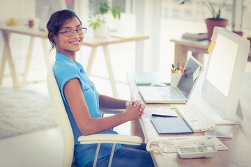 Casual designer working at her desk