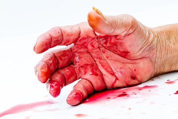 bloody hand on the table. a violence or fear horror concept. © nitimongkolchai