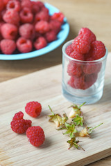 Raspberry on old vintage wooden table.
