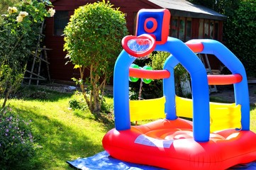 Colorful bouncing castle in the garden