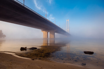 Bridge over morning misty river. Kiev. Ukraine