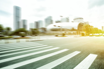 Blurred motion of modern skyline and urban street