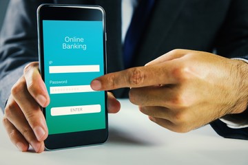 Composite image of businessman using smartphone