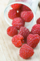 Raspberry on old vintage wooden table.