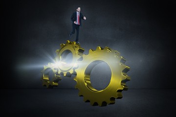Composite image of smiling young businessman in suit running 