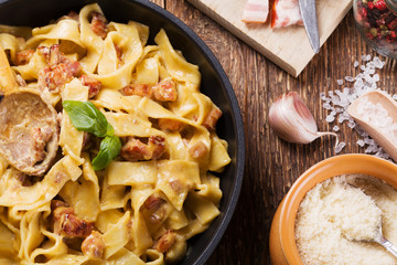 Pasta Carbonara with bacon, basil and cheese