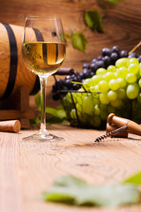 Glass of white wine, served with grapes