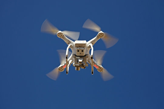 Quadrocopter Drone - UAV - flying in the sky - camera