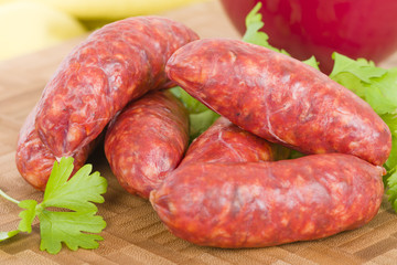 Chorizo - Spicy sausage on a wooden board.