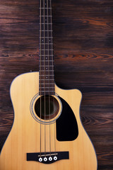 Fototapeta premium Acoustic guitar on wooden background