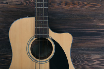 Obraz premium Acoustic guitar on wooden background