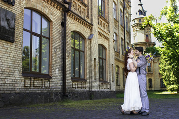 Bride and groom in beautiful decor with heart. Wedding beautiful couple in love