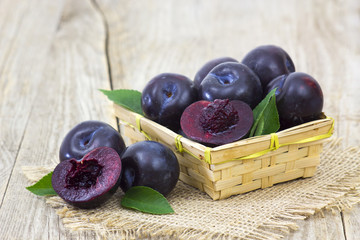 fresh plums in a basket