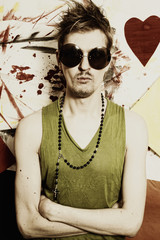 Young punk man wearing sunglasses