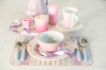 Beautiful holiday table setting in pink color