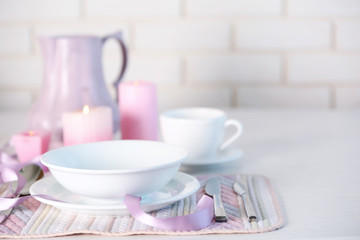Beautiful holiday table setting in pink color