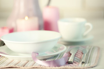 Beautiful holiday table setting in pink color