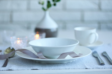 Beautiful holiday table setting in white and gray color