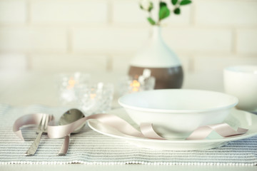 Beautiful holiday table setting in white and gray color