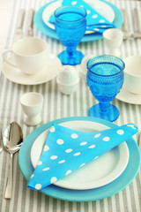 Beautiful holiday table setting in white and blue color