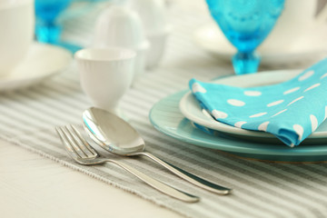 Beautiful holiday table setting in white and blue color