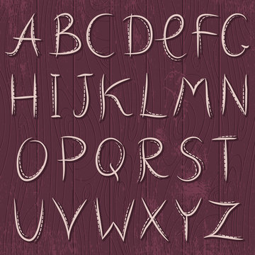 Decorative alphabet on wooden background, vector
