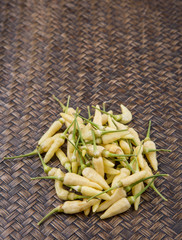 Thai chili or bird's eye chili over wicker background