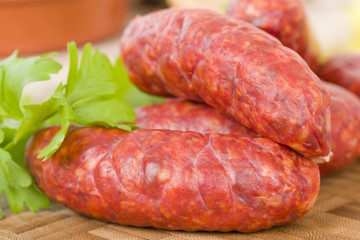 Chorizo - Spicy sausage on a wooden board.