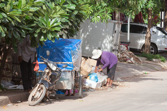 Cambodian family searching for food in the rubbish