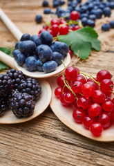 spoons with different berries