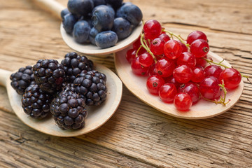 spoons with different berries