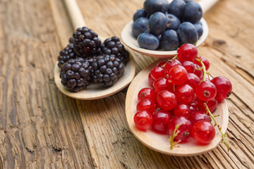 spoons with different berries