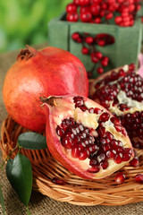 Pomegranate seeds on wicker tray, closeup