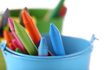 Colorful pastel crayons in holders, closeup