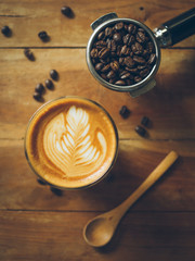 cup of coffee latte on the wood texture