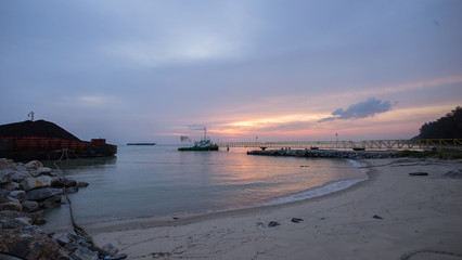 beautiful sunset at beach with jetty. Malacca, Malaysia