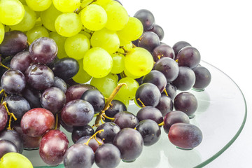 Grapes with white background on glass table